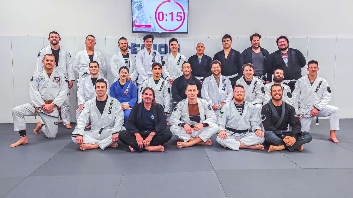 Adult beginner jiu-jitsu class group photo at Legion